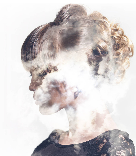 Double exposure of woman profile portrait and clouds - Valokuva, kuva