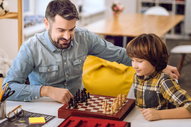 Positive delighted relatives playing chess - Photo, Image