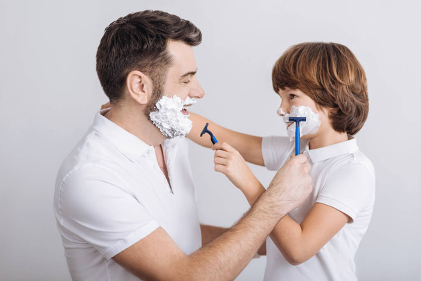delighted man and boy going to shave - Фото, изображение