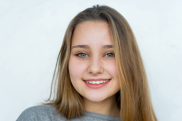 Teenager girl posing on white background isolated - Fotó, kép