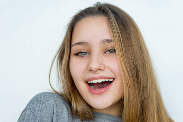 Teenager girl posing on white background isolated - 写真・画像