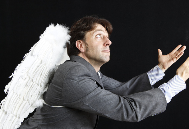 Businessman with angel wings - Foto, imagen