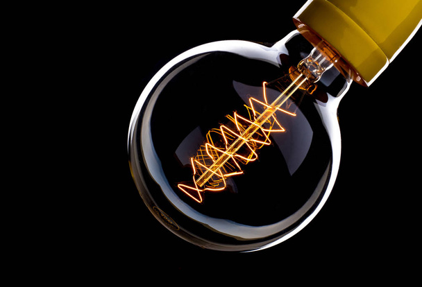 close up shot on light bulb on the dark for creativity - Φωτογραφία, εικόνα