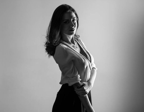 Pretty model woman posing in studio - Photo, Image