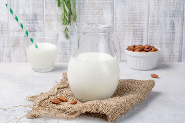 Homemade almon milk in a jug - 写真・画像