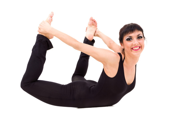 Young smiling acrobat posing - Foto, afbeelding