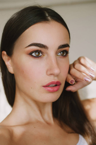 Good skin after the cream . Portrait  beautiful Girl brunette with stylish makeup and manicure. Facial - Fotoğraf, Görsel