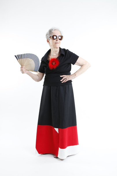 Fashionable granny with fan in her hand - Fotoğraf, Görsel