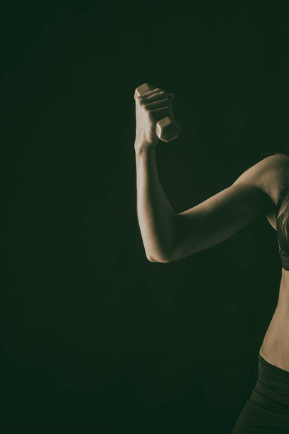 fitness woman body on a black background - Foto, Imagem