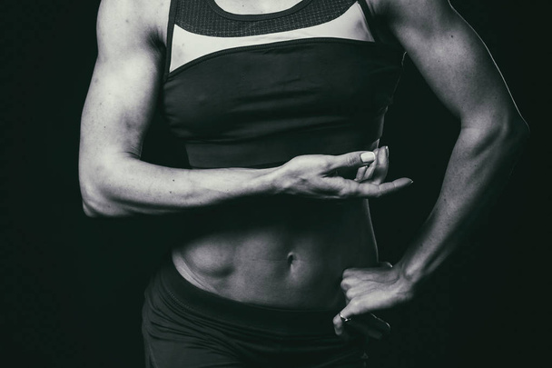 Torso of a young fit woman - Фото, изображение