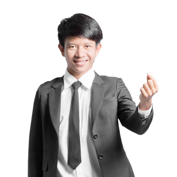 Portrait of a handsome businessman showing mini heart finger. Is - Photo, Image