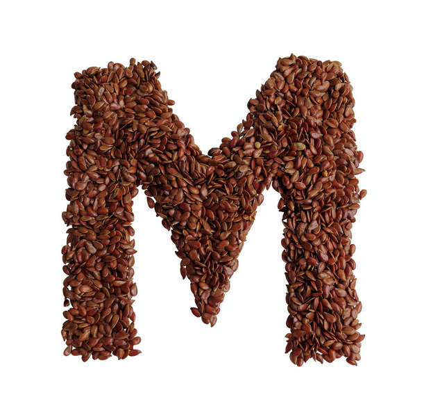 Letter M made with Linseed also known as flaxseed isolated on wh - 写真・画像