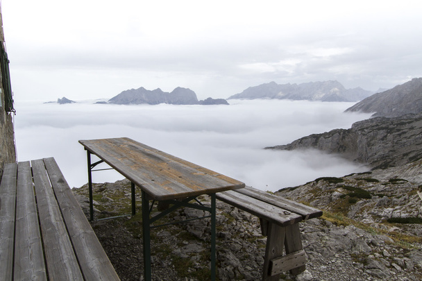 Resting bench above the clouds - Photo, Image
