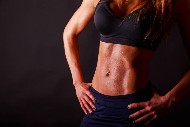 figure fitness girl on a black background - Photo, Image