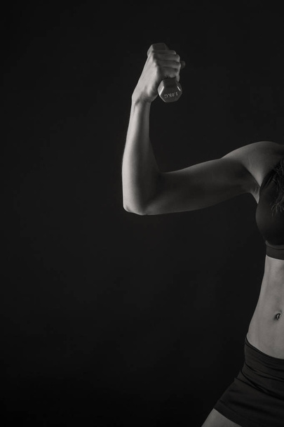 figure fitness girl on a black background - Photo, Image