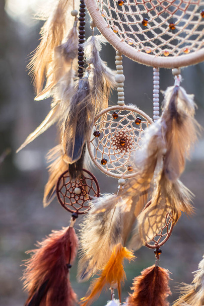 Dreamcatcher made of feathers, leather, beads, and ropes - Фото, зображення