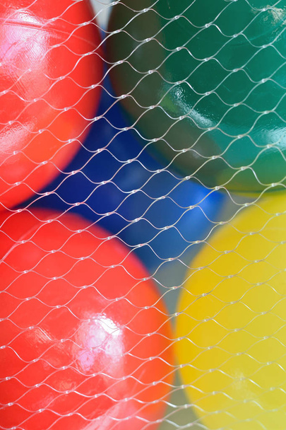Macro texture of colorful plastic balls & nylon threads - Photo, Image