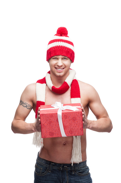 Sexy macho holding red gift - Zdjęcie, obraz