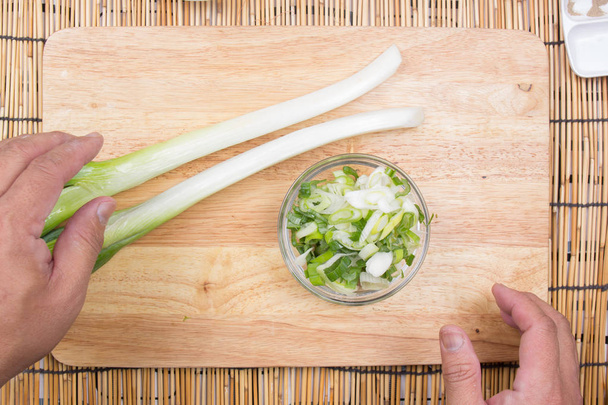 Chef putting slice of scallion to cup - Photo, Image