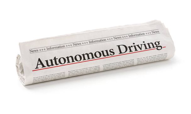 Walcowane gazeta z nagłówkiem autonomicznej jazdy - Zdjęcie, obraz