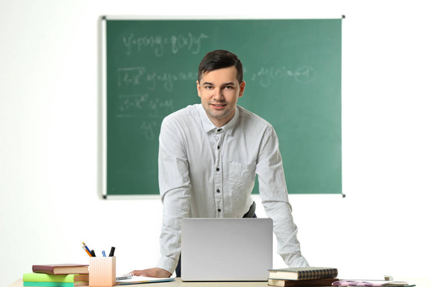 Handsome young teacher working  - Photo, Image
