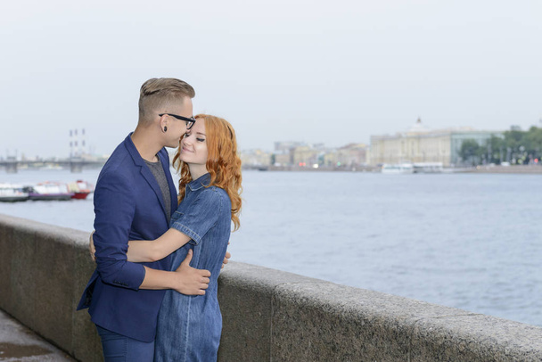 Love Story of young couple in St. Petersburg landmarks background - Photo, Image
