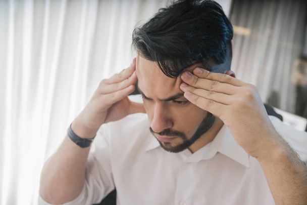Businessman with headache in office  on background - Foto, Imagem