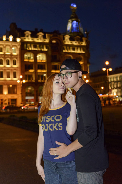 Love Story of young couple in St. Petersburg landmarks background - Φωτογραφία, εικόνα