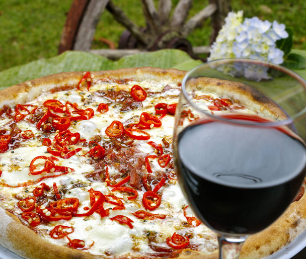 Pizza with glass of wine - Фото, изображение