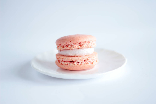One pink macarons on the wight backround - Фото, зображення