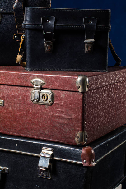 Close-up of a stack vintage shabby suitcases - Фото, изображение