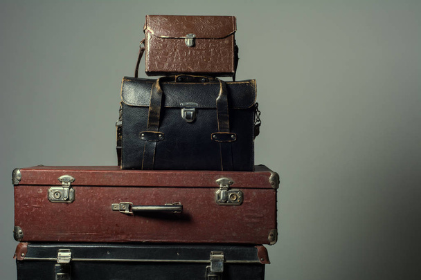 Background stack of old suitcases form a tower - 写真・画像
