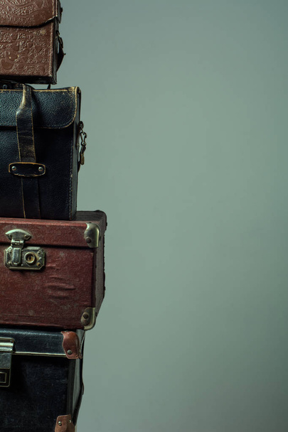 Background stack of old shabby suitcases form a tower - Фото, зображення