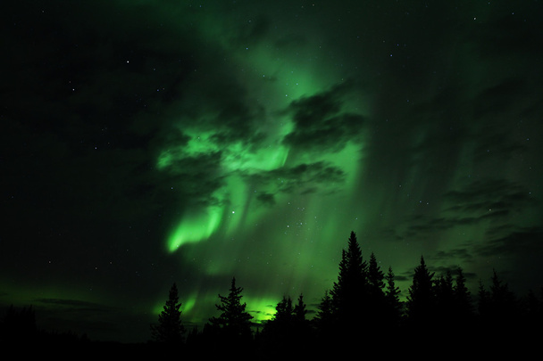 Aurora borealis with clouds - Foto, afbeelding