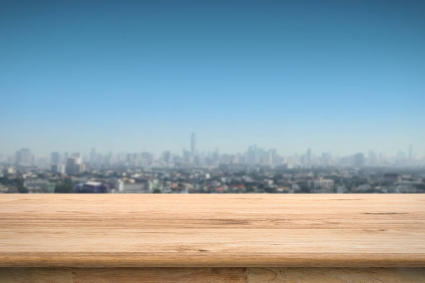 wooden counter with cityscape background - Photo, Image