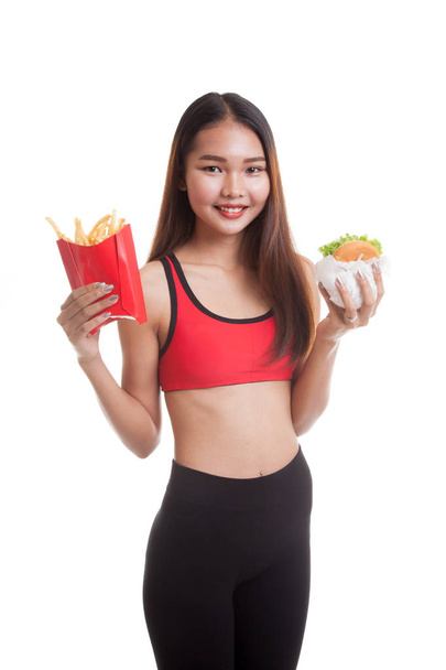 Beautiful Asian healthy girl with french fries and hamburger. - Photo, image