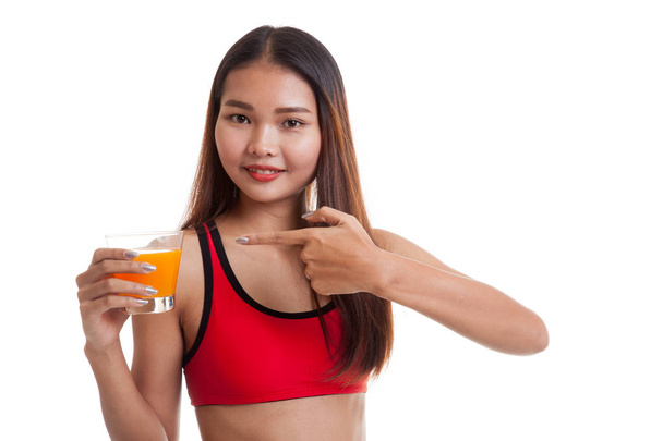 Beautiful Asian healthy girl point to orange juice. - Фото, зображення
