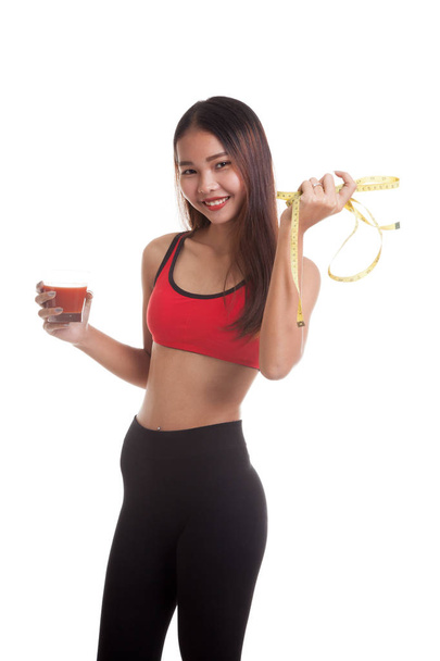 Healthy Asian girl diet with tomato juice and measuring tape on  - Photo, image