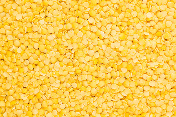 Yellow purified lentil closeup top view background.  - 写真・画像
