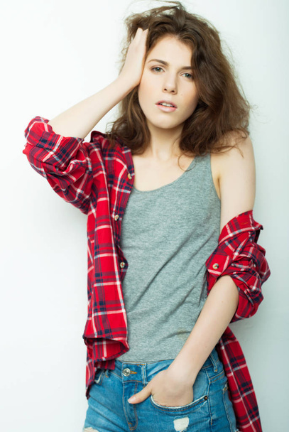 lifestyle, fashion and people concept: beautiful woman wearing casual clothes, posing on white background - 写真・画像