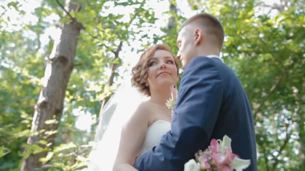 Bride and groom pose in the wood - Footage, Video