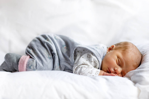 Portrait of cute adorable newborn baby girl sleeping - Foto, Imagen
