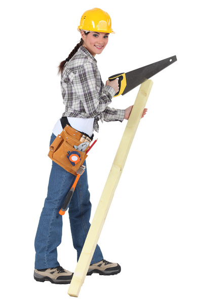 Woman with a saw and timber - Zdjęcie, obraz