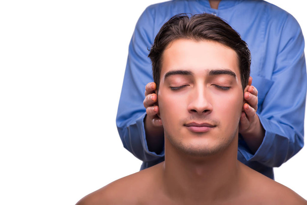 Man during massage session isolated on white - Foto, Bild