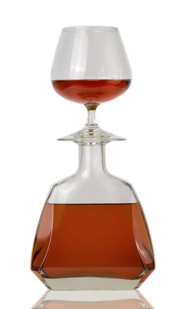 glass of cognac and a bottle - Photo, Image