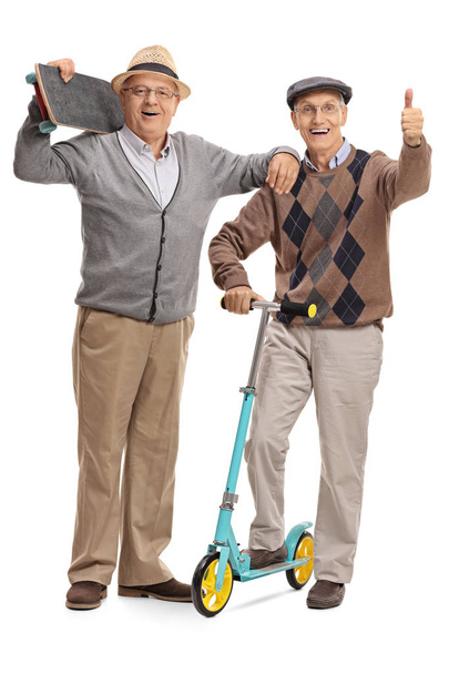 Mature man with skateboard and man giving thumb up - Photo, image