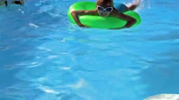Child floating on inflatable ring in sea. - Footage, Video