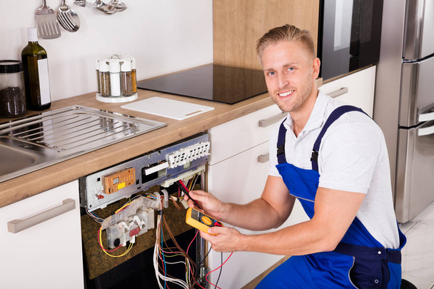 Technician Checking Dishwasher - Photo, image