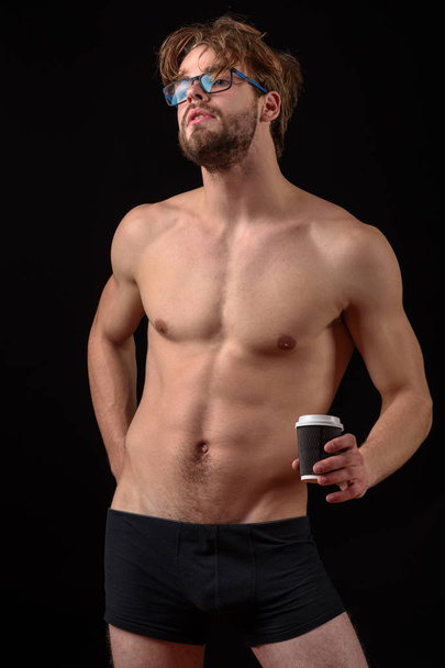 bearded sexy man holding coffee - Foto, afbeelding