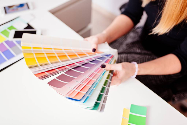 Woman designer or architect choosing color - 写真・画像